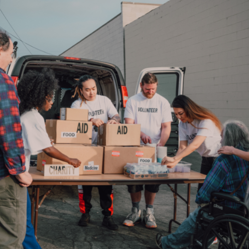 image of a donation table with helpers giving out donations.